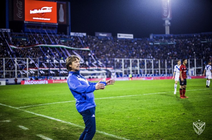 Lautaro Gianetti of Argentina's Velez Sarsfield, top, heads the